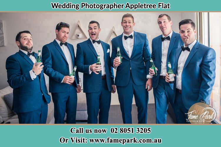 The groom and his groomsmen striking a wacky pose in front of the camera Appletree Flat NSW 2330