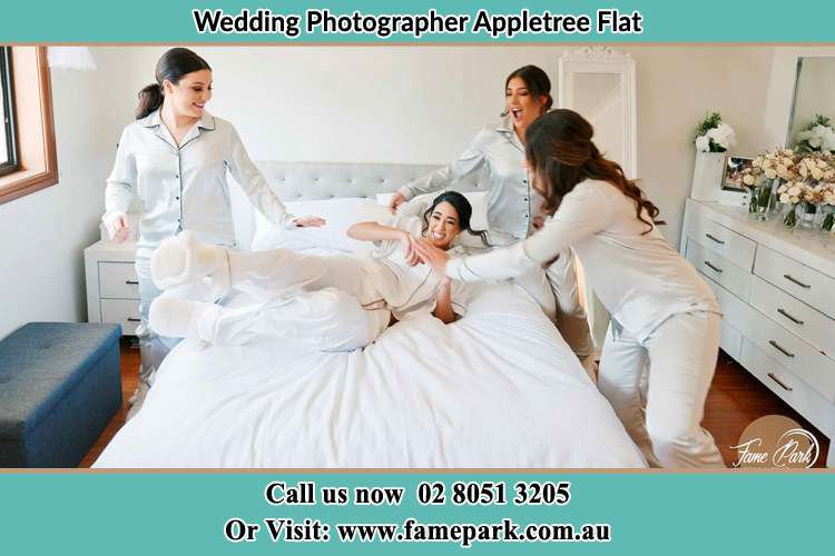 Photo of the Bride and the bridesmaids playing on bed Appletree Flat NSW 2330