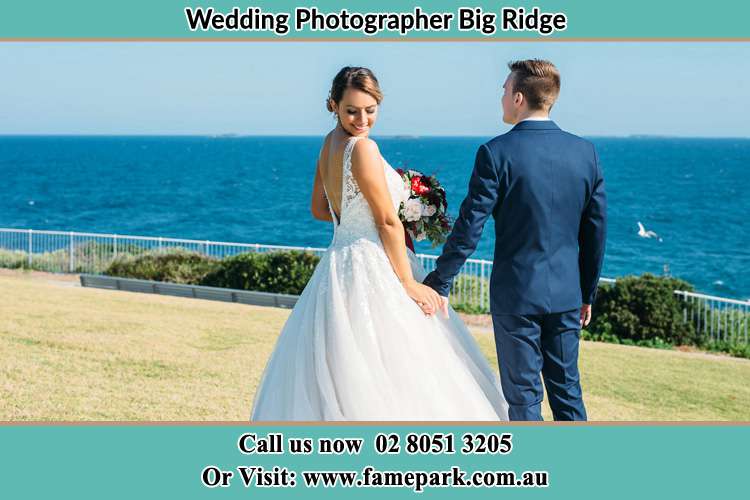 Photo of the Bride and the Groom holding hands at the yard Big Ridge NSW 2330