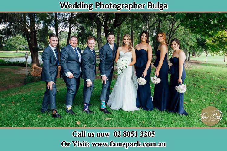 The Bride and the Groom with their entourage pose for the camera Bulga NSW 2330