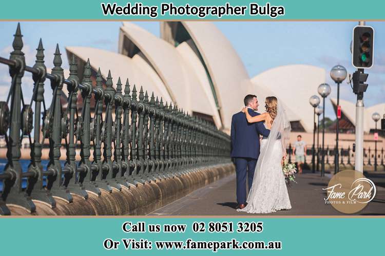 The Groom and the Bride walking towards the Sydney Grand Opera House Bulga NSW 2330