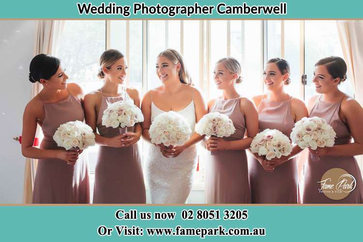 Photo of the Bride and the bridesmaids holding flower bouquet Camberwell NSW 2330