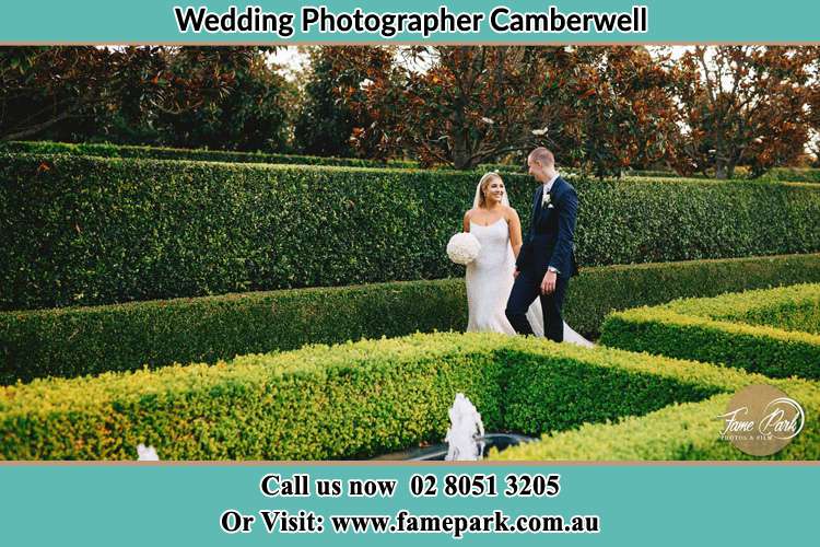 Photo of the Groom and the Bride walking at the garden Camberwell NSW 2330