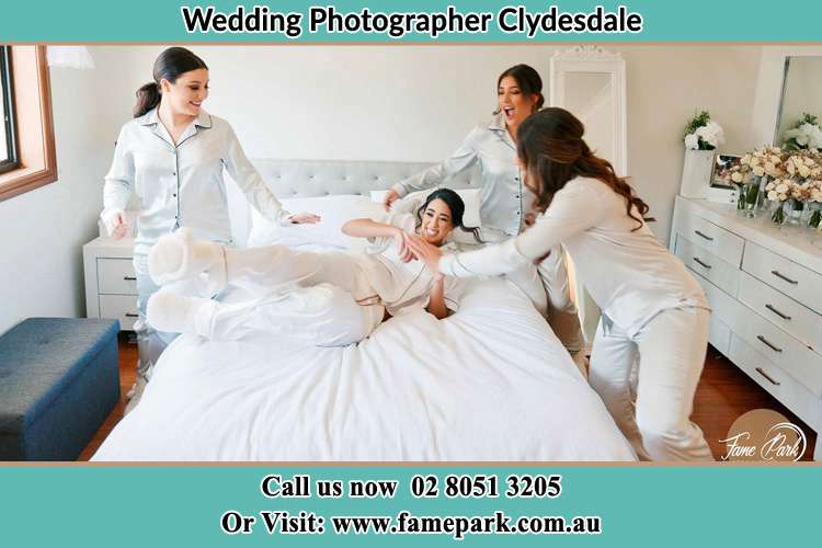 Photo of the Bride and the bridesmaids playing on bed Clydesdale NSW 2330