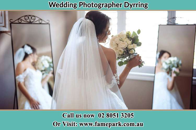 Photo of the Bride holding flower at the front of the mirrors Dyrring NSW 2330