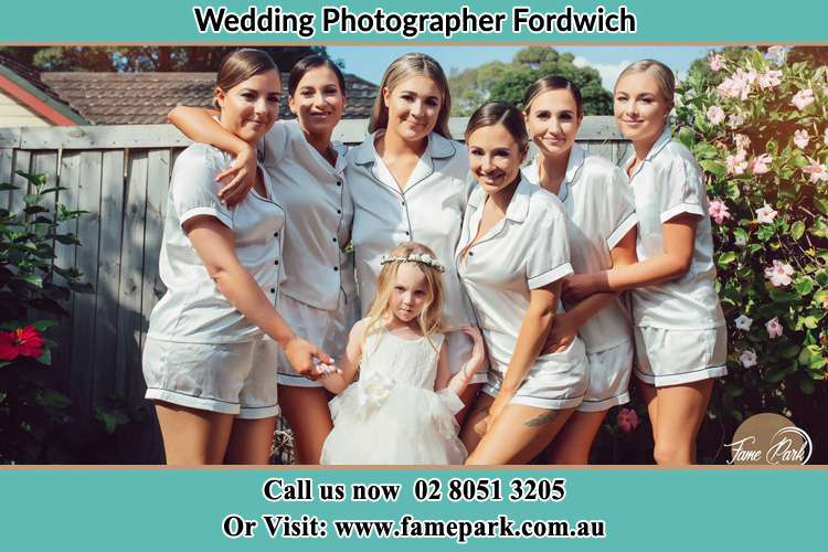 Photo of the Bride and the bridesmaids with the flower girl Fordwich NSW 2330