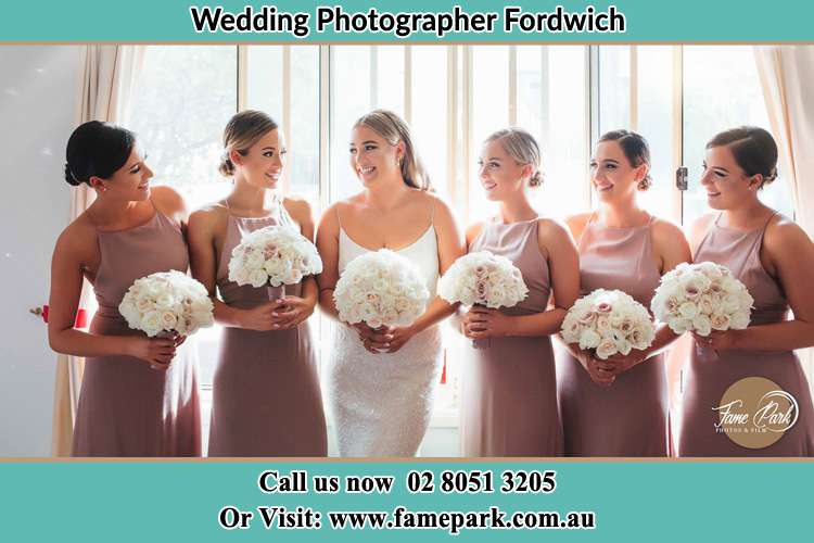 Photo of the Bride and the bridesmaids holding the flower bouquet Fordwich NSW 2330 