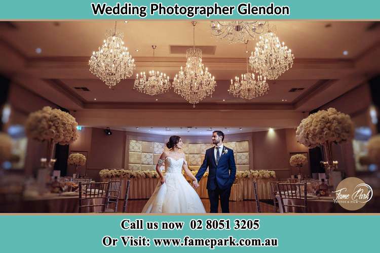 Photo of the Bride and the Groom holding hands on the dance floor Glendon NSW 2330