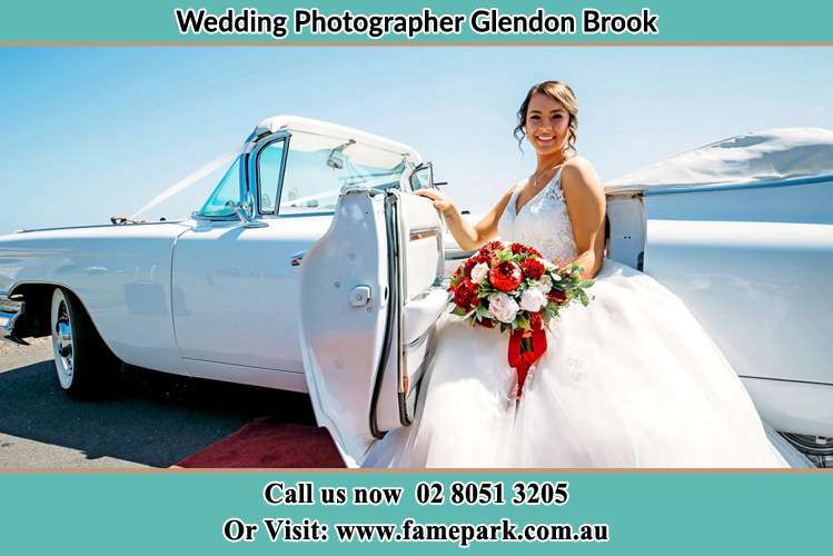 Photo of the Bride outside the bridal car Glendon Brook NSW 2330