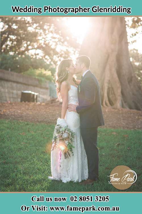 Photo of the Bride and the Groom kissing at the yard Glenridding NSW 2330