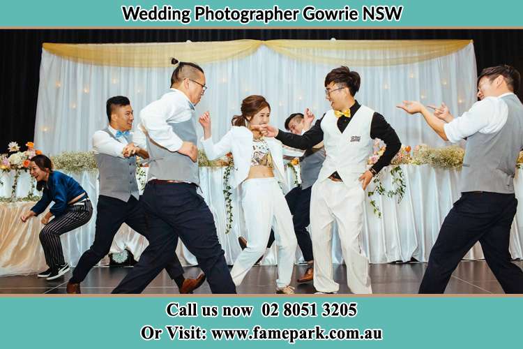 Photo of the Groom and the Bride dancing with the groomsmen on the dance floor Gowrie NSW 2060