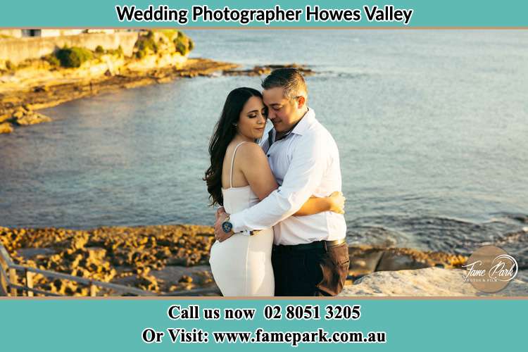 Photo of the Bride and the Groom hugging near the lake Howes Valley NSW 2330