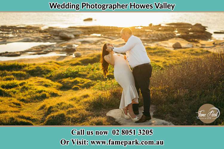 Photo of the Bride and the Groom dancing near the lake Howes Valley NSW 2330