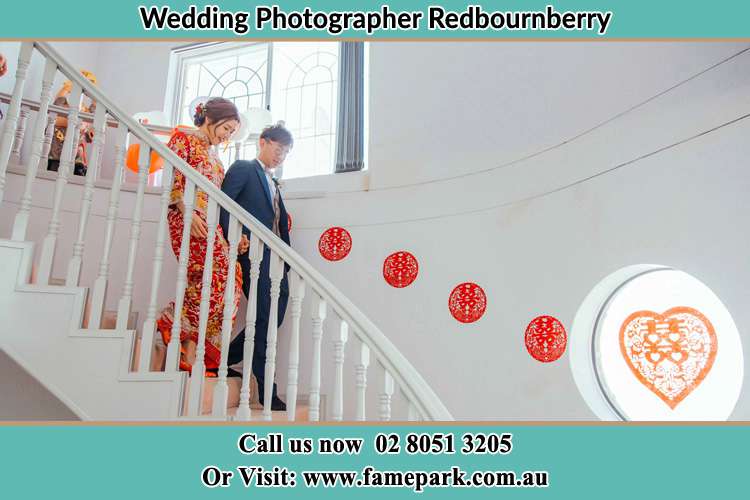 Photo of the Bride and the Groom going down the stair Redbournberry NSW 2330