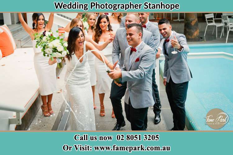 Photo of the Groom and the Bride celebrating with the secondary sponsors Stanhope NSW 2335