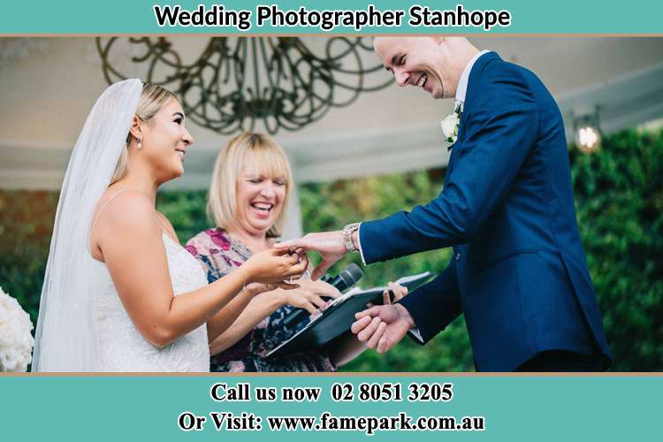 Photo of the Bride wearing ring to the Groom Stanhope NSW 2335