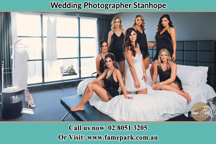 Photo of the Bride and the bridesmaids wearing lingerie on bed Stanhope NSW 2335