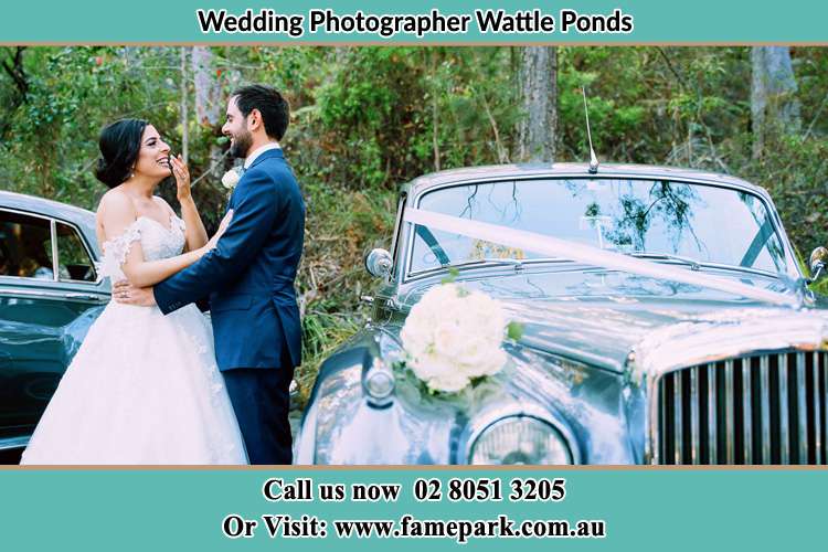 Photo of the Bride and the Groom near the bridal car Wattle Ponds NSW 2330