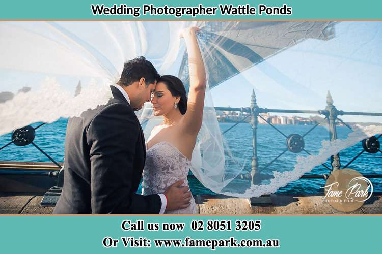 Photo of the Groom and the Bride kissing Wattle Ponds NSW 2330